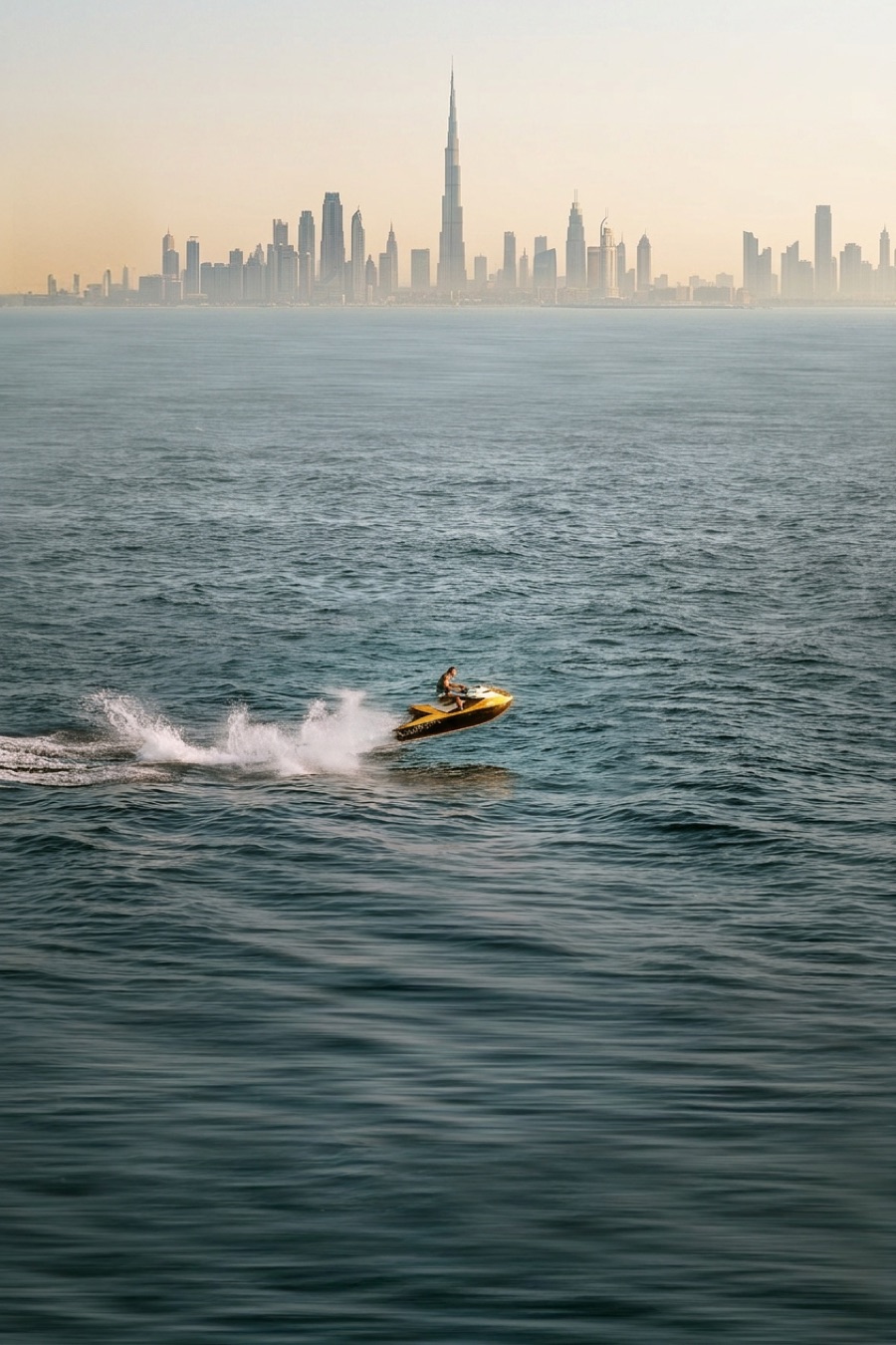 Jet ski rider carving past the Dubai skyline