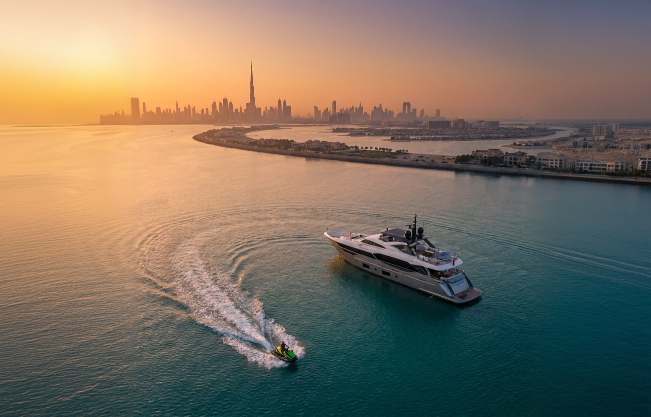 Yacht cruising off the Dubai coast at golden hour